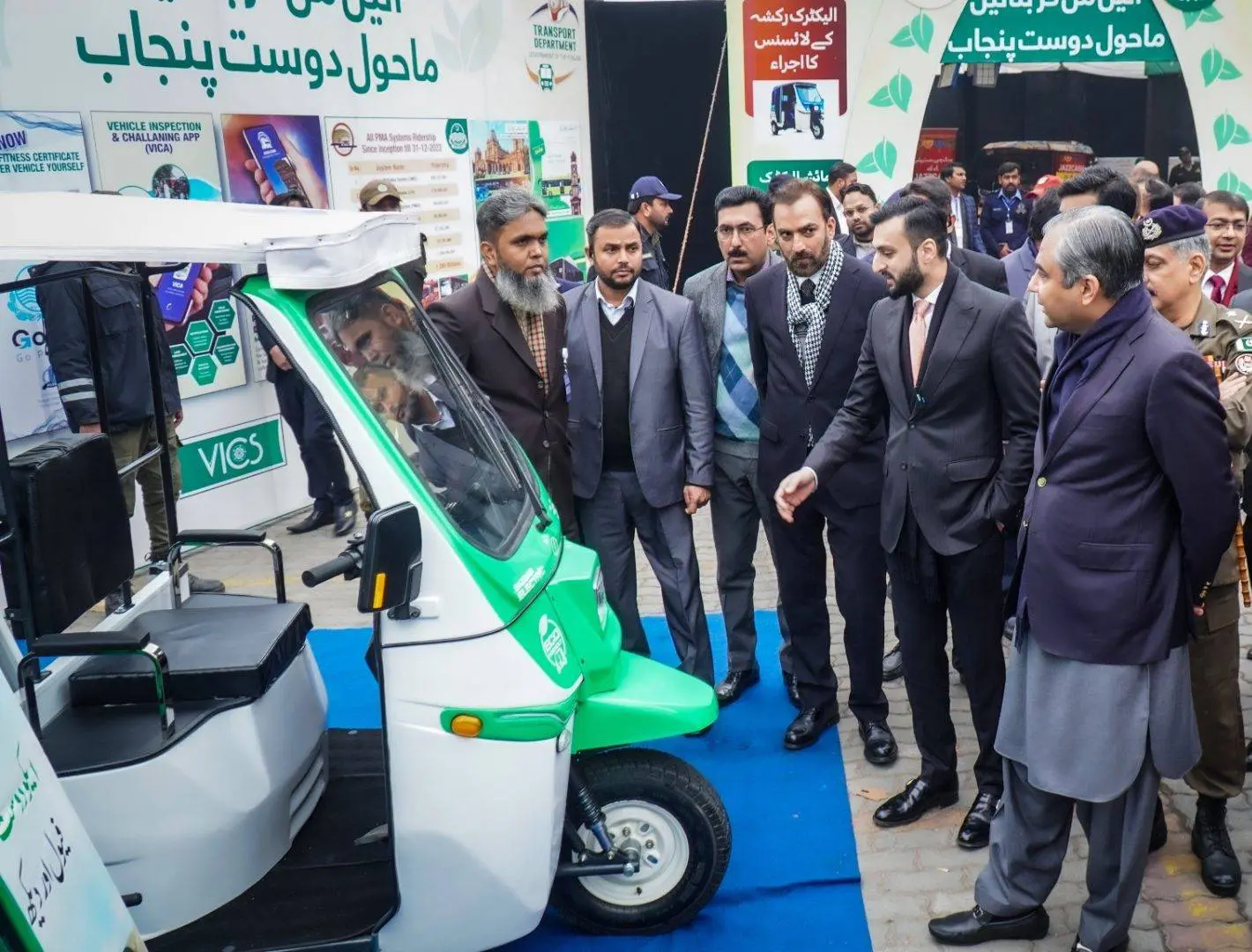 Chief Minister handing over e-motorcycles to students
